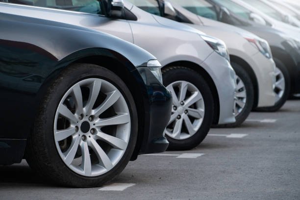 cheap car loans A lot of cars in a rows. Used car sales.